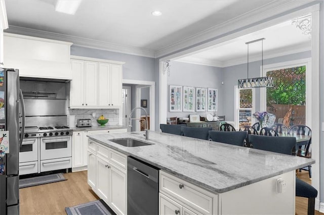 9035 Walnut Cove Ct, Gainesville, GA 30506 - kitchen featuring appliances with stainless steel finishes, a sink, light wood-type flooring, white cabinets, and ornamental molding