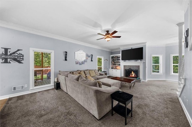 9035 Walnut Cove Ct, Gainesville, GA 30506 - living area with a warm lit fireplace, carpet, a ceiling fan, baseboards, and ornamental molding