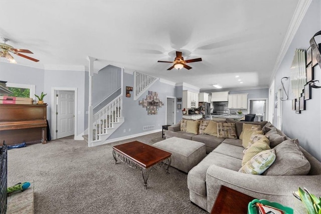 9035 Walnut Cove Ct, Gainesville, GA 30506 - living room featuring a ceiling fan, stairs, crown molding, and light carpet