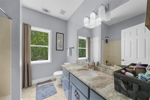 9035 Walnut Cove Ct, Gainesville, GA 30506 - bathroom with healthy amount of natural light, a shower, vanity, and tile patterned flooring