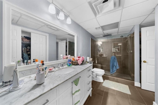 9035 Walnut Cove Ct, Gainesville, GA 30506 - bathroom featuring a stall shower, vanity, tile patterned flooring, toilet, and a drop ceiling