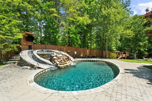 9035 Walnut Cove Ct, Gainesville, GA 30506 - view of swimming pool with a playground, a fenced backyard, a patio area, and view of scattered trees