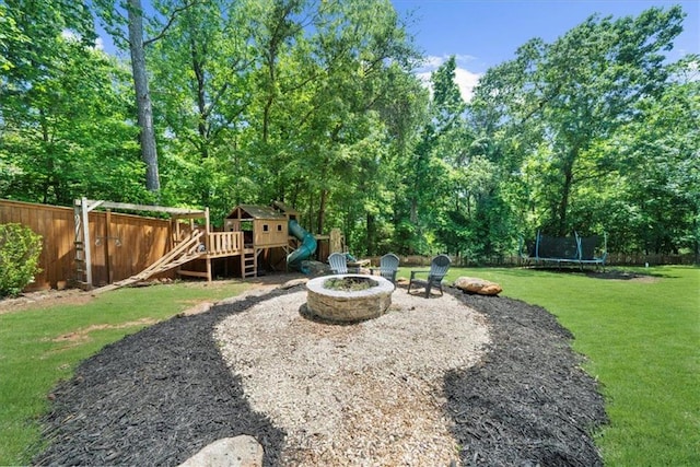 9035 Walnut Cove Ct, Gainesville, GA 30506 - view of yard with an outdoor fire pit and a trampoline