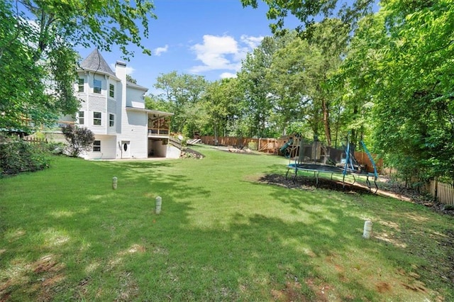 9035 Walnut Cove Ct, Gainesville, GA 30506 - view of yard featuring a trampoline and a playground