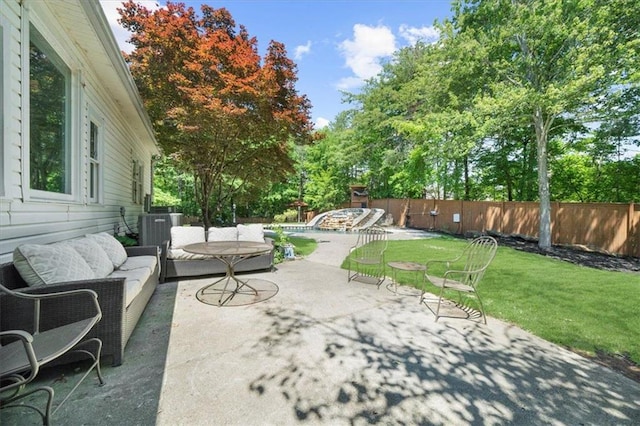 9035 Walnut Cove Ct, Gainesville, GA 30506 - view of patio / terrace with an outdoor living space, a pool, central air condition unit, and view of wooded area