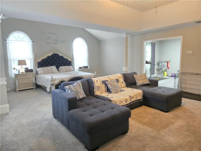 carpeted bedroom featuring lofted ceiling