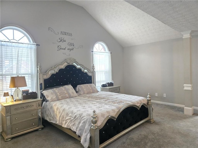 bedroom featuring a textured ceiling, baseboards, vaulted ceiling, dark colored carpet, and decorative columns