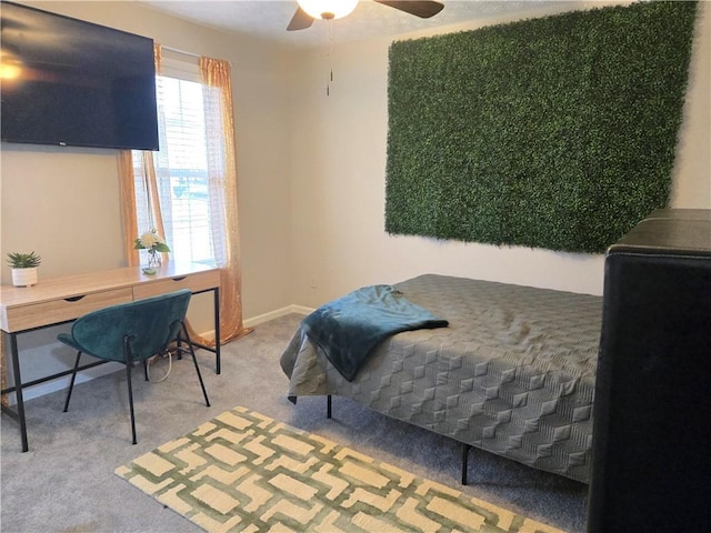 carpeted bedroom featuring a ceiling fan and baseboards