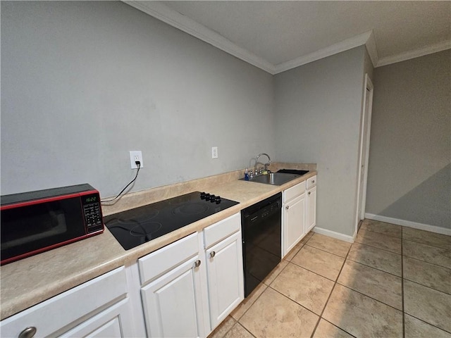 kitchen featuring light countertops, ornamental molding, white cabinetry, a sink, and black appliances