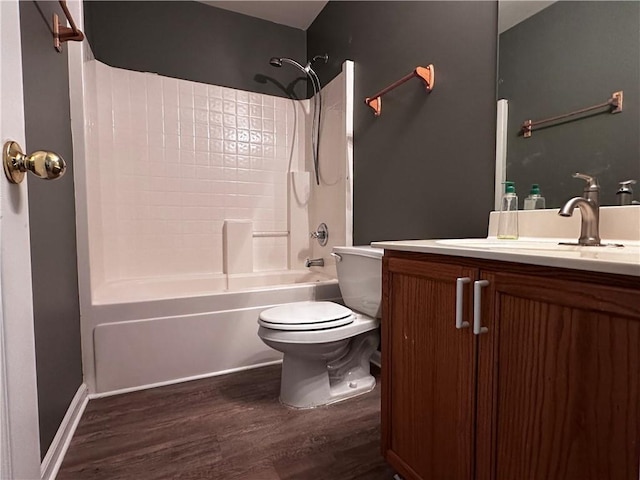 full bathroom featuring toilet, vanity, bathtub / shower combination, and wood finished floors