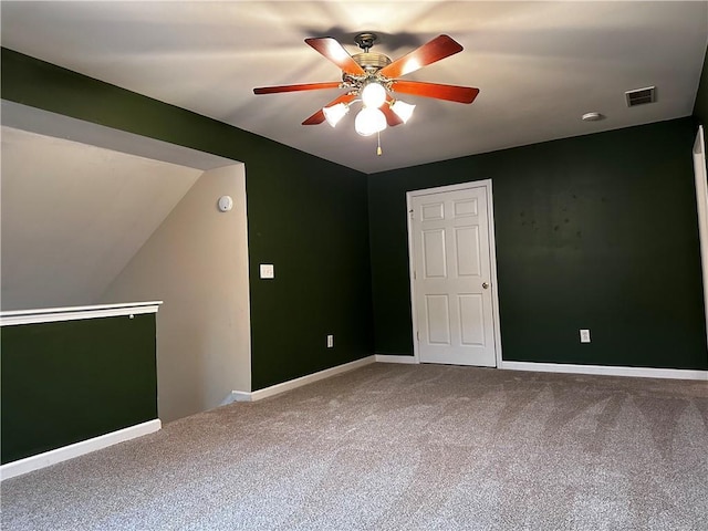 empty room with a ceiling fan, baseboards, visible vents, and carpet floors