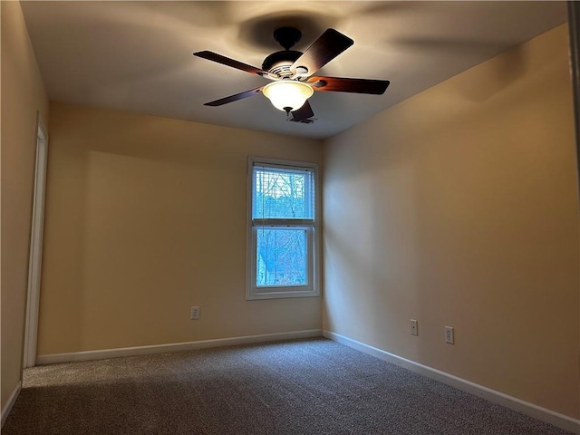 empty room featuring baseboards, a ceiling fan, and carpet flooring