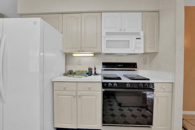 kitchen with white appliances, white cabinetry, baseboards, and light countertops