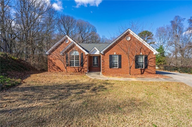 ranch-style house with a front lawn