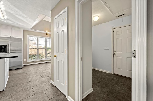 hall with light tile patterned flooring