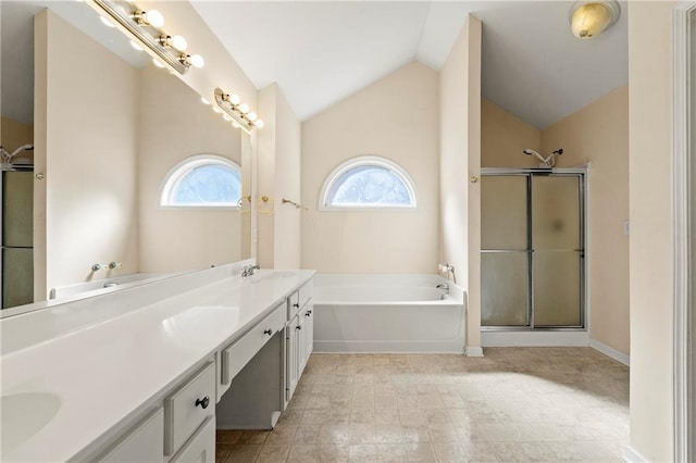 bathroom featuring vanity, lofted ceiling, and shower with separate bathtub