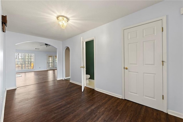 empty room with ceiling fan and wood-type flooring