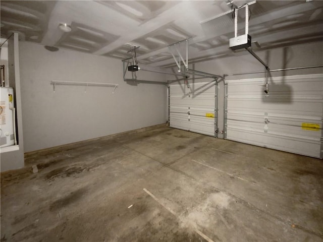 garage with gas water heater and a garage door opener