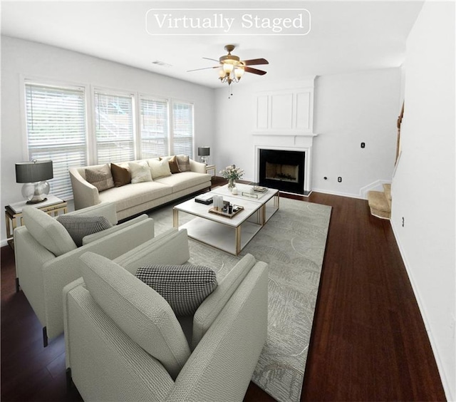 living room featuring ceiling fan and hardwood / wood-style floors