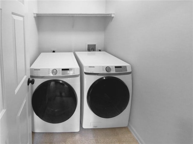 clothes washing area featuring independent washer and dryer