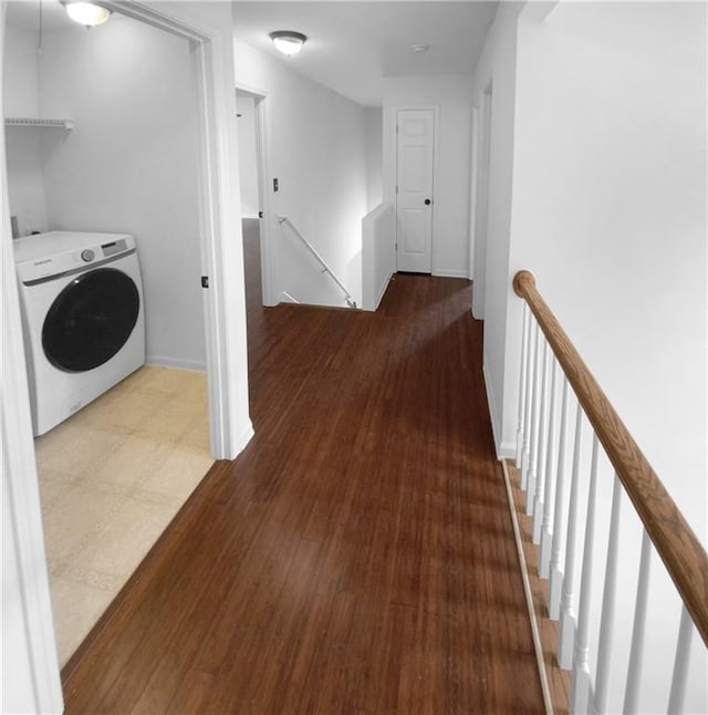 hall with washer / dryer and wood-type flooring