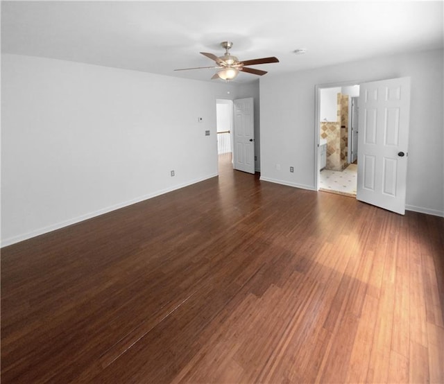 interior space with dark wood-type flooring and ceiling fan