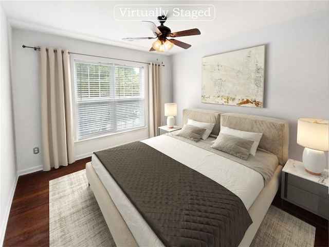 bedroom with dark wood-type flooring and ceiling fan