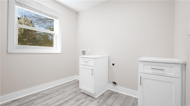 clothes washing area with washer hookup, light wood-style flooring, baseboards, and hookup for an electric dryer