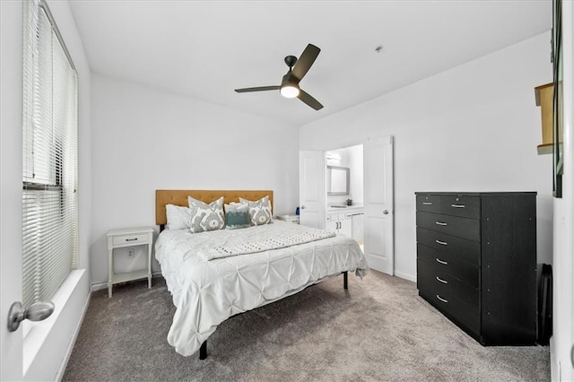 carpeted bedroom with a ceiling fan and baseboards