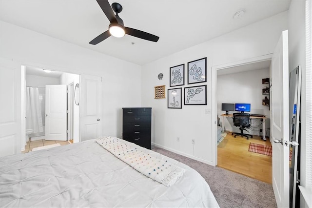 bedroom featuring ensuite bath, carpet, baseboards, and ceiling fan