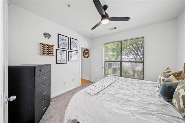 bedroom with a ceiling fan, baseboards, visible vents, and carpet flooring