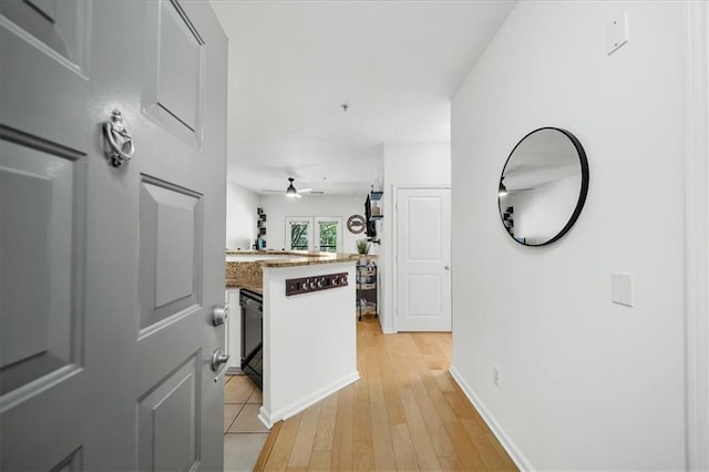 hallway featuring light wood-style flooring