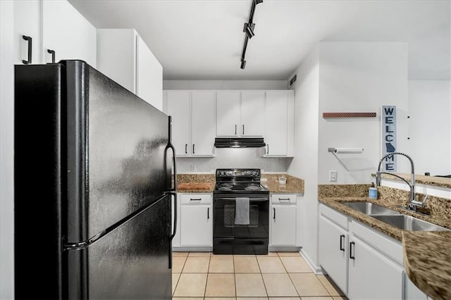 kitchen with light tile patterned floors, under cabinet range hood, black appliances, white cabinetry, and a sink