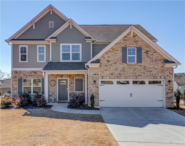 craftsman inspired home with driveway and brick siding