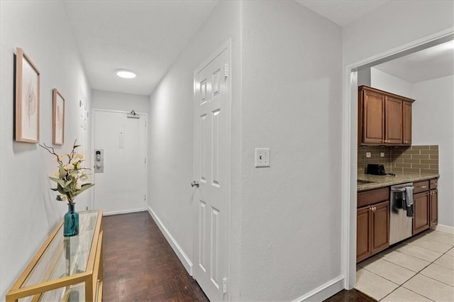 corridor featuring light tile patterned floors