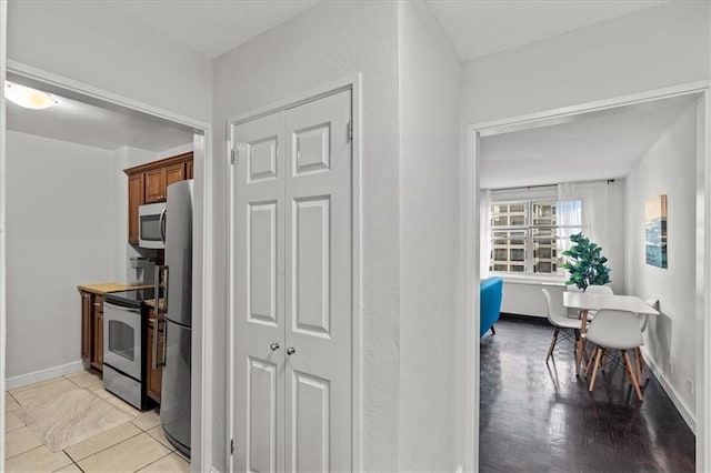 kitchen featuring light hardwood / wood-style flooring and appliances with stainless steel finishes