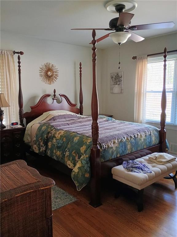 bedroom featuring ceiling fan and wood finished floors