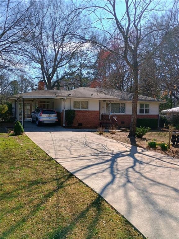 ranch-style house with a front lawn, crawl space, brick siding, and concrete driveway