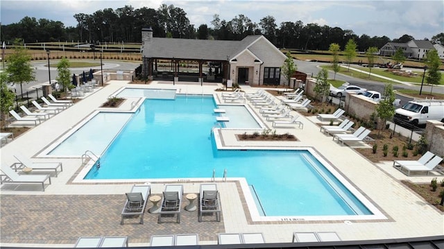 view of swimming pool with a patio