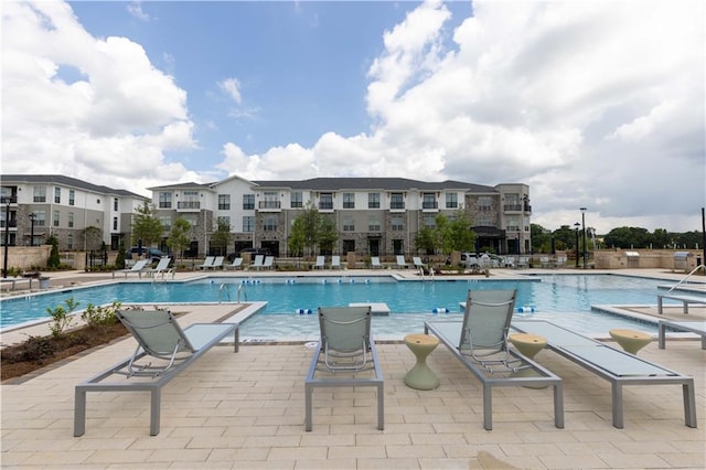 view of pool featuring a patio area