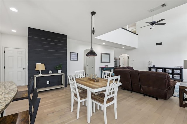 dining area featuring light hardwood / wood-style flooring and ceiling fan