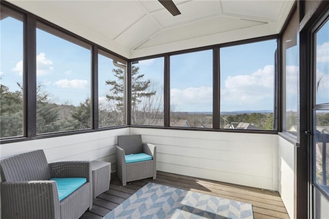 unfurnished sunroom featuring vaulted ceiling