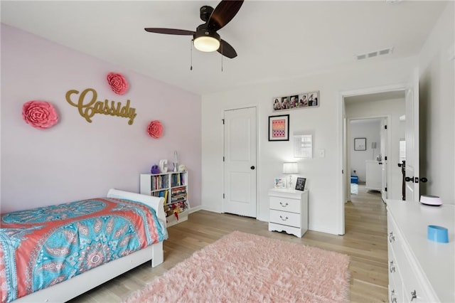 bedroom featuring light hardwood / wood-style flooring and ceiling fan