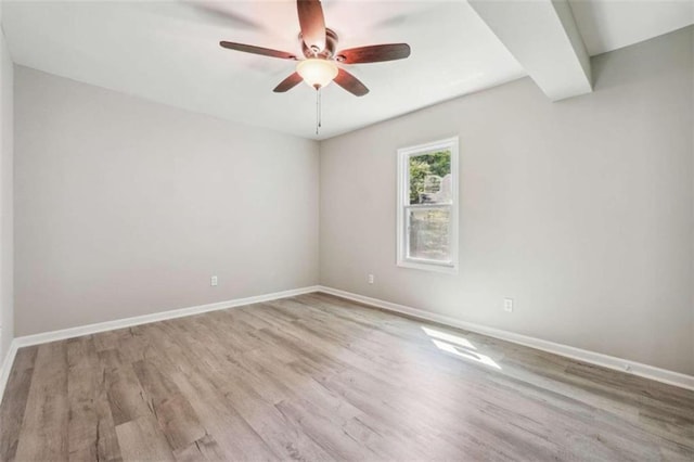 empty room featuring hardwood / wood-style flooring and ceiling fan