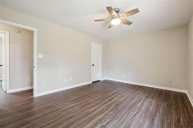 unfurnished room featuring ceiling fan and dark hardwood / wood-style flooring