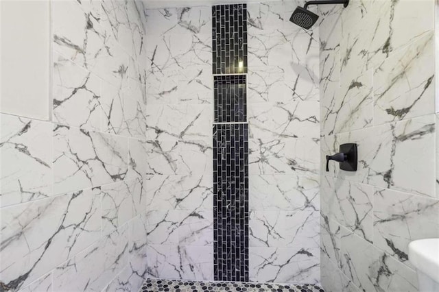 bathroom with tiled shower