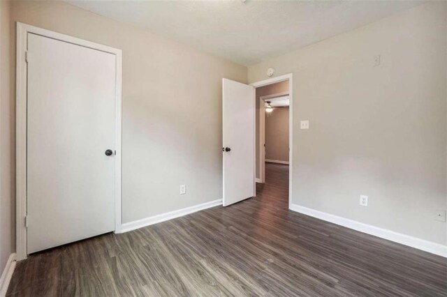 spare room featuring dark hardwood / wood-style floors