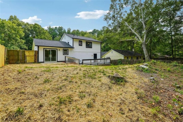 rear view of house with a deck