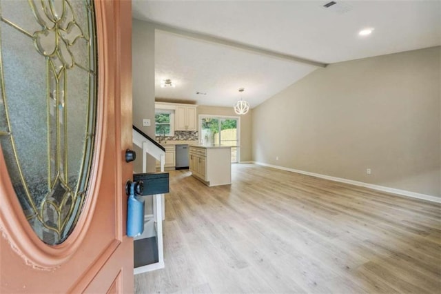 living room featuring light wood-type flooring and vaulted ceiling