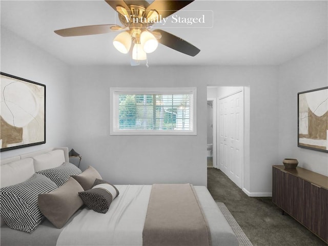 carpeted bedroom featuring ceiling fan and a closet